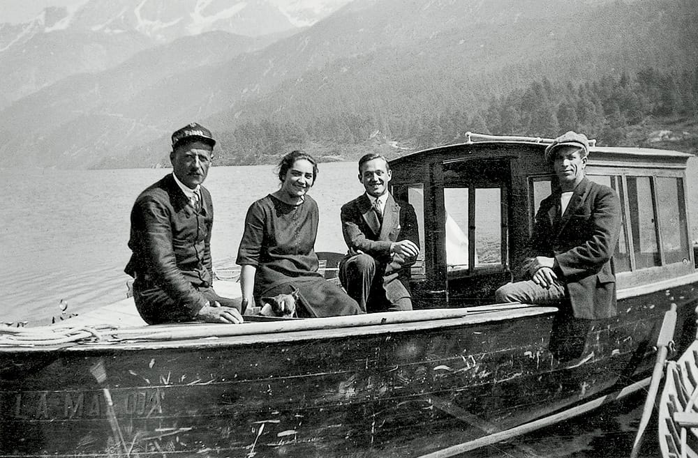 Vintage image of four people on an early Cranchi boat, showcasing the heritage and craftsmanship.
