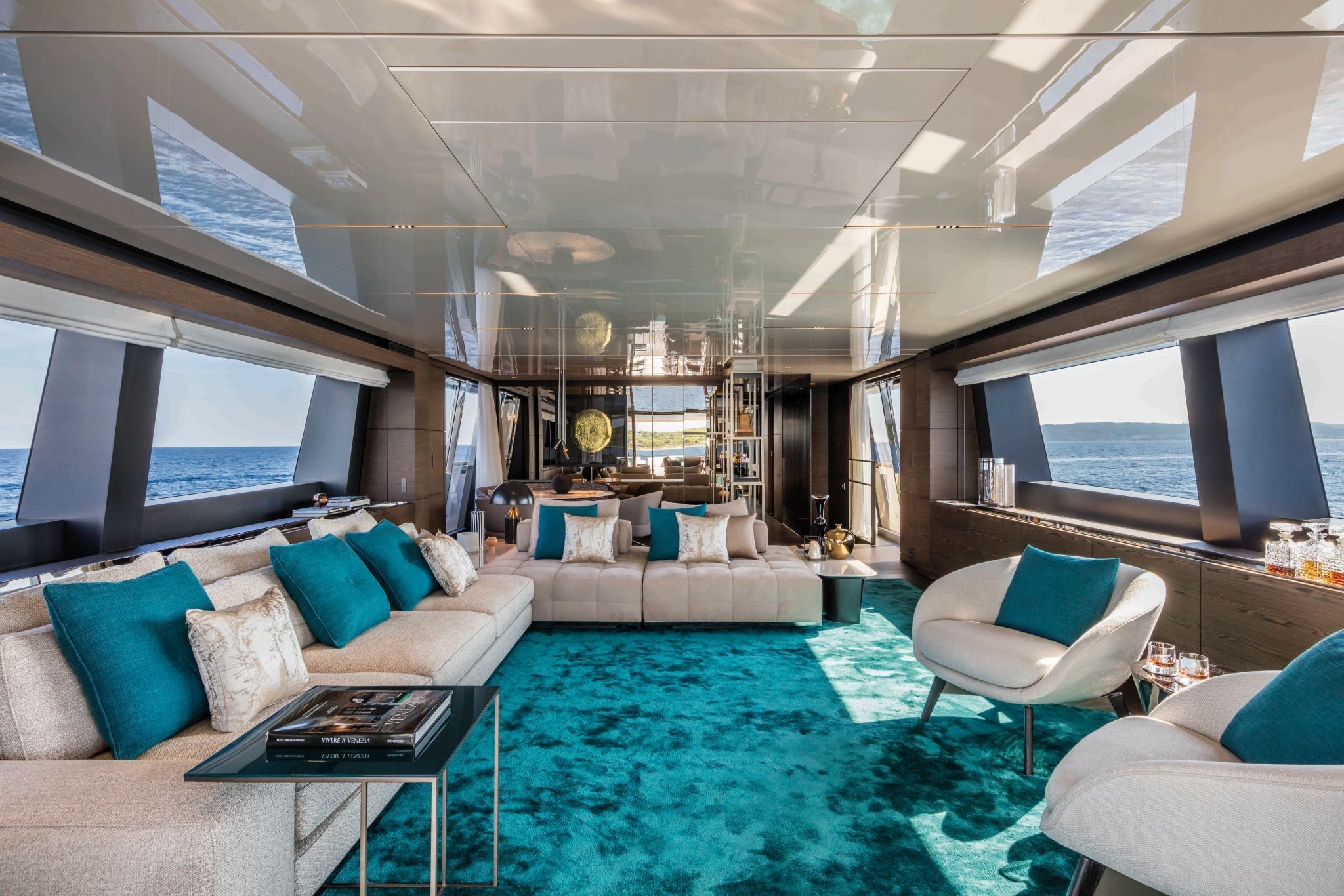 Main deck saloon of the Custom Line Navetta 42 with intimate dining and lounging zones.