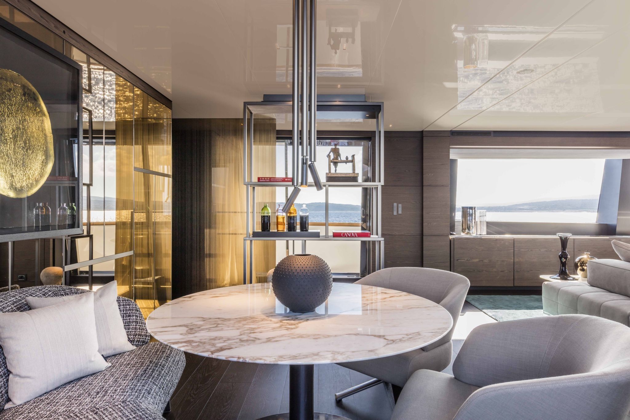 Custom Line Navetta 42 yacht interior by Starship Yachts, with modern decor, marble table, and ambient lighting.