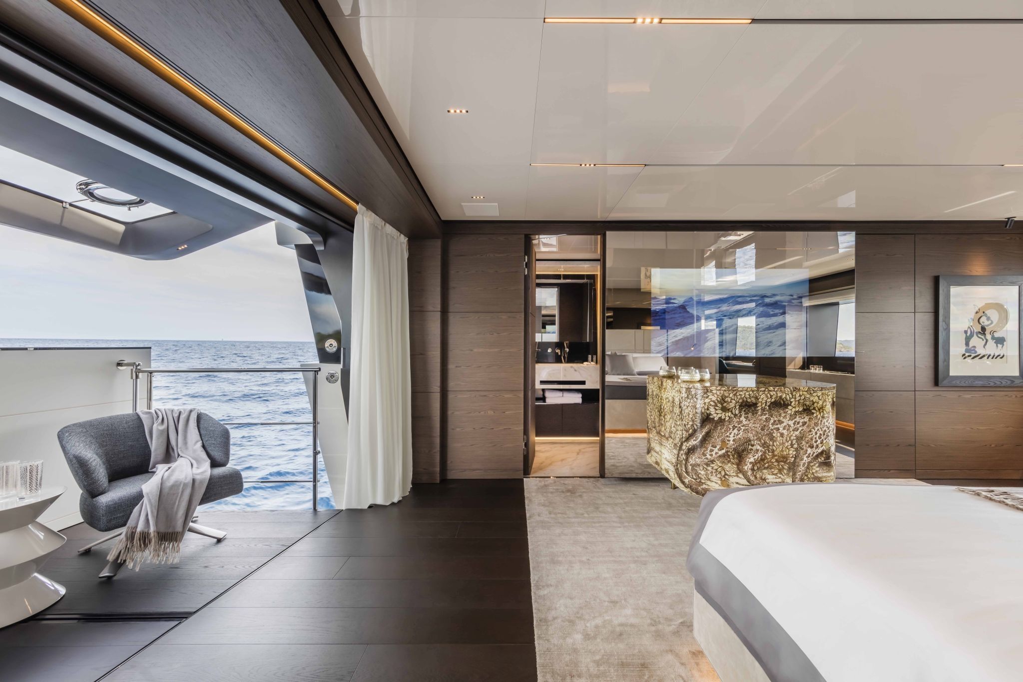 Upper deck of the Custom Line Navetta 42 with natural materials and soft furnishings.