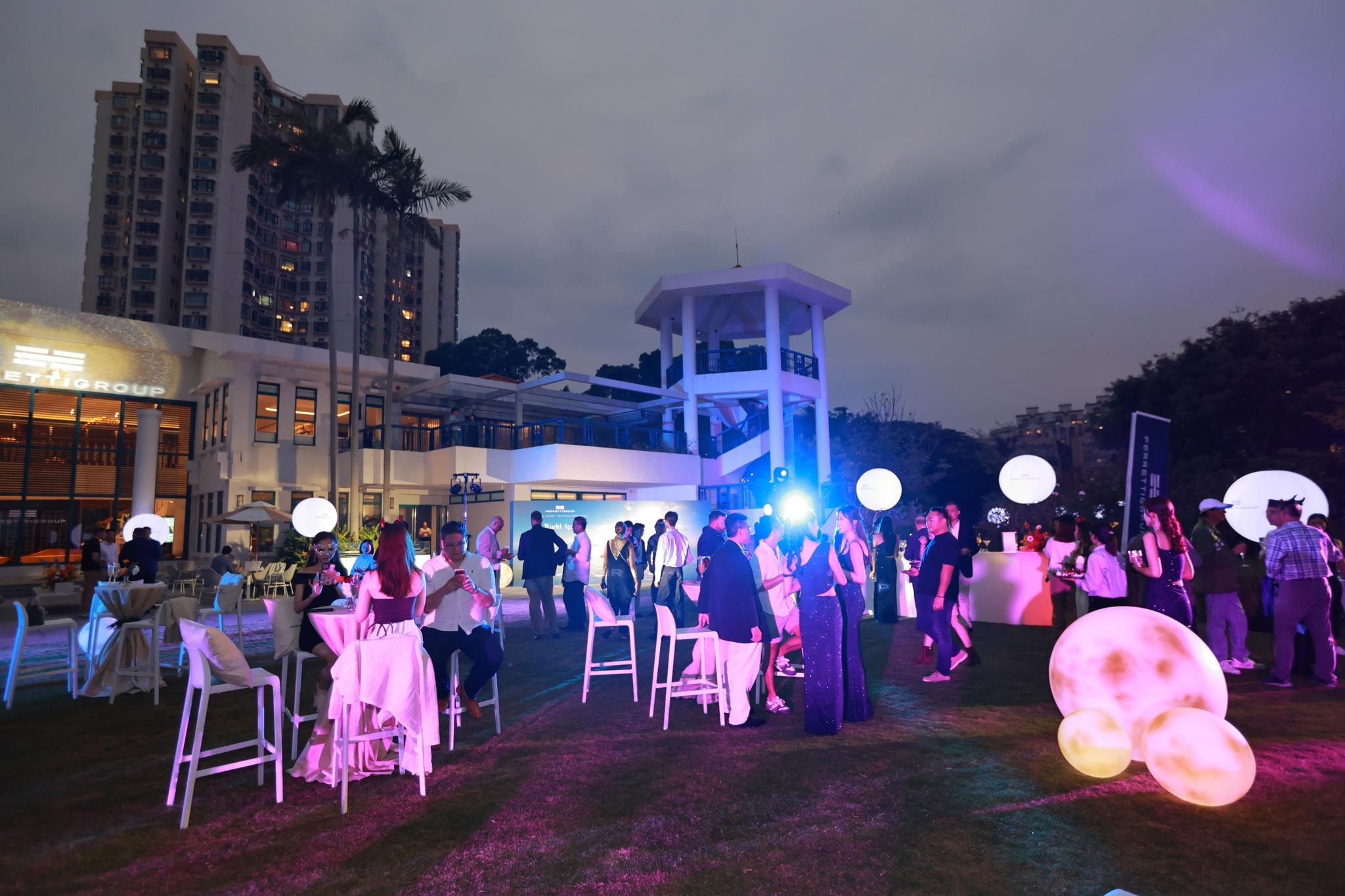 Riva 110 anchored at dusk with sunset view