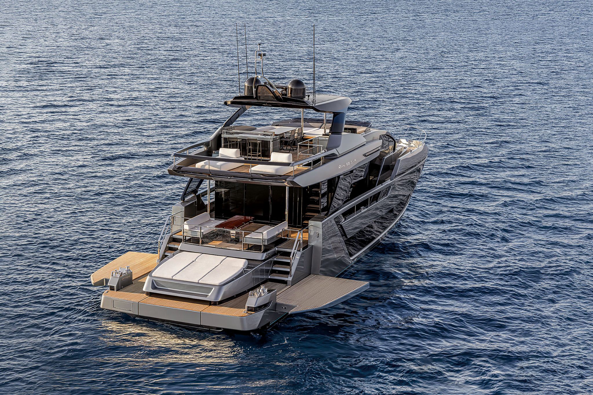 Aerial view of the Riva Diva 82 yacht on the water with a large sun deck and open lounging area.
