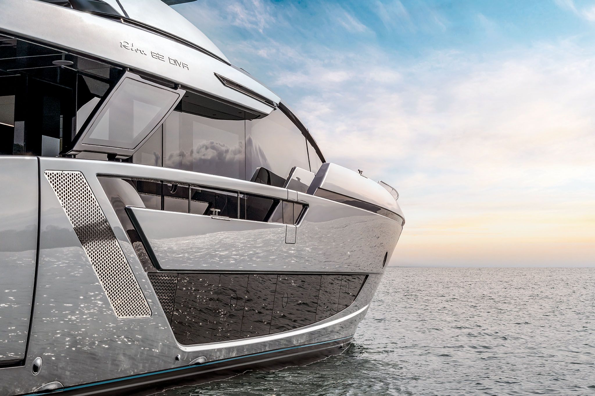 Close-up side shot of the Riva Diva 82 yacht's sleek design while anchored in calm waters.