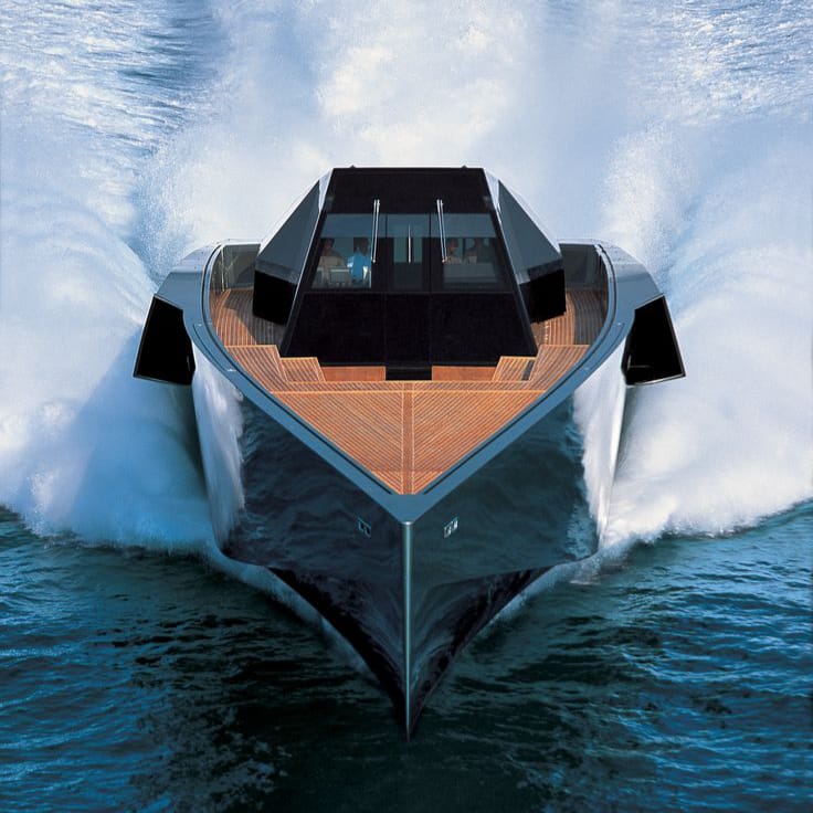 Luxury yachts for sale: Wallypower 118 yacht cruising at high speed, showcasing its sharp, futuristic design on open waters.