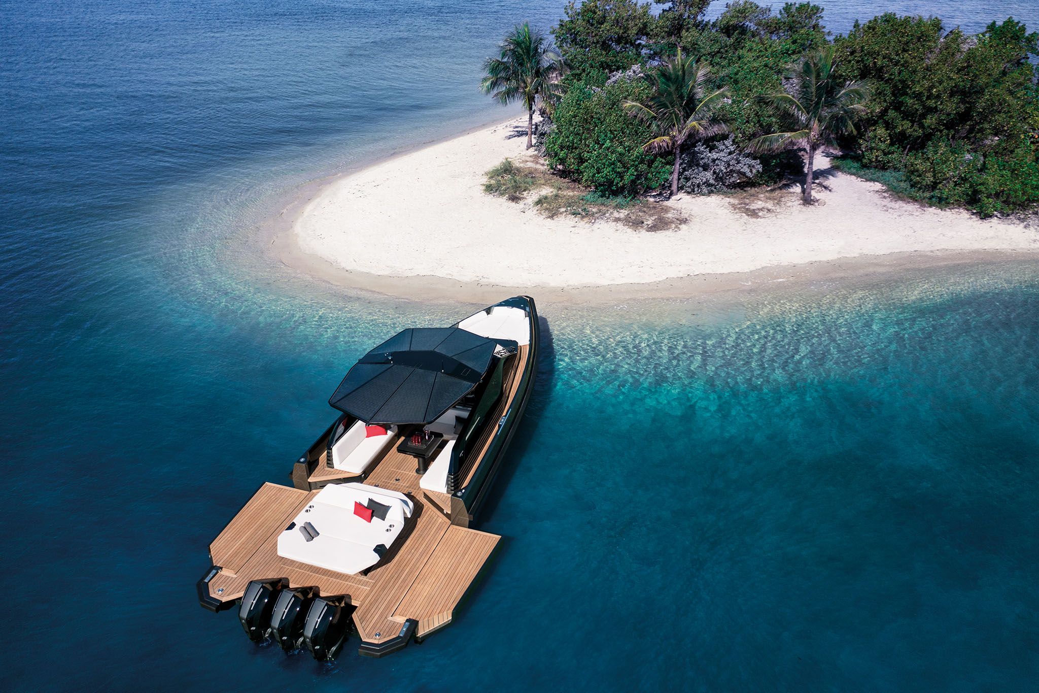 Wally Tender 43X anchored off an idyllic island with white sand