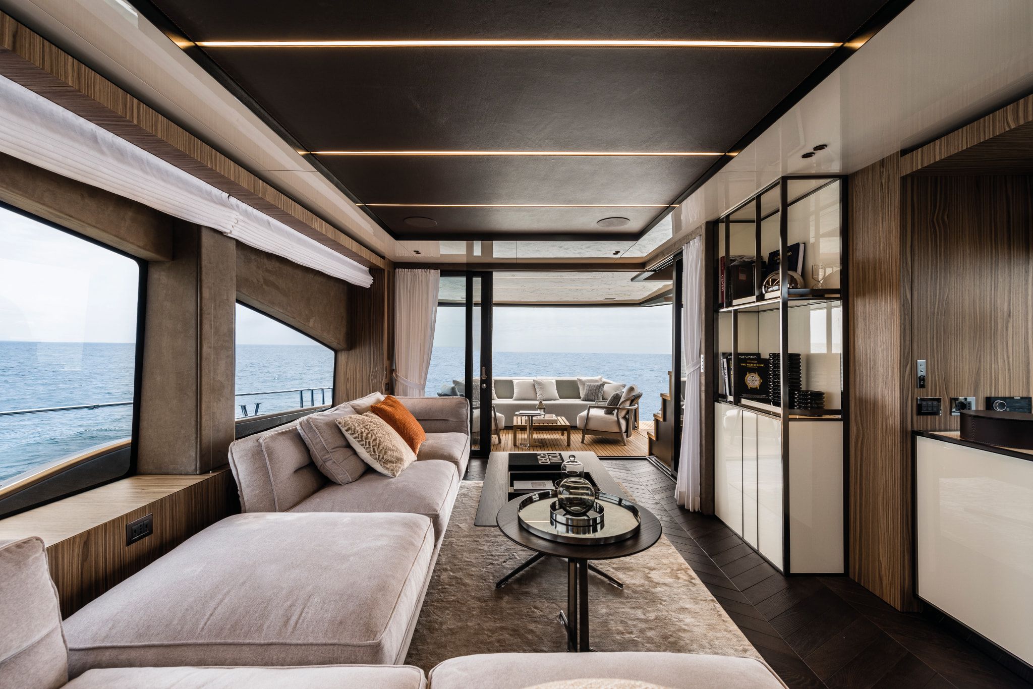 Cranchi Settantotto yacht interior with plush seating, spacious lounge, and ocean views.