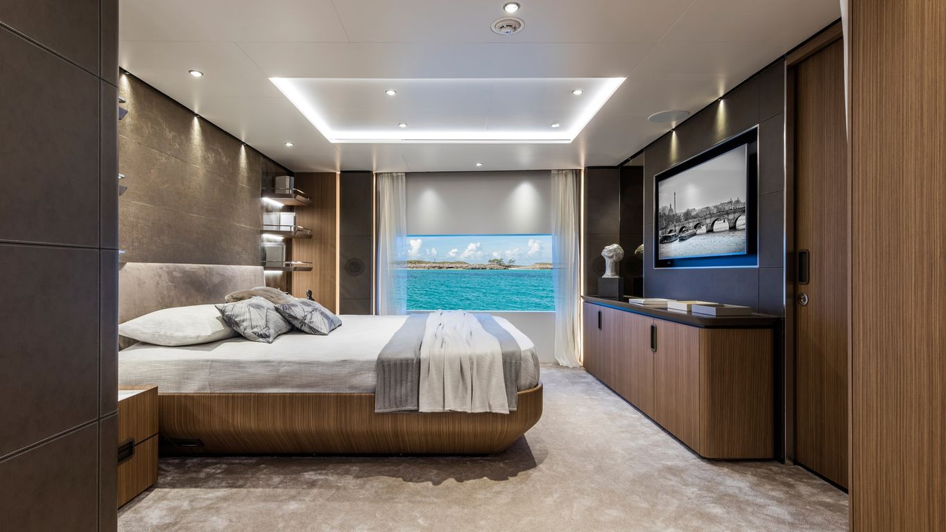 Luxurious master bedroom offering a scenic ocean view and minimalist design on a yacht, Custom Line 120.