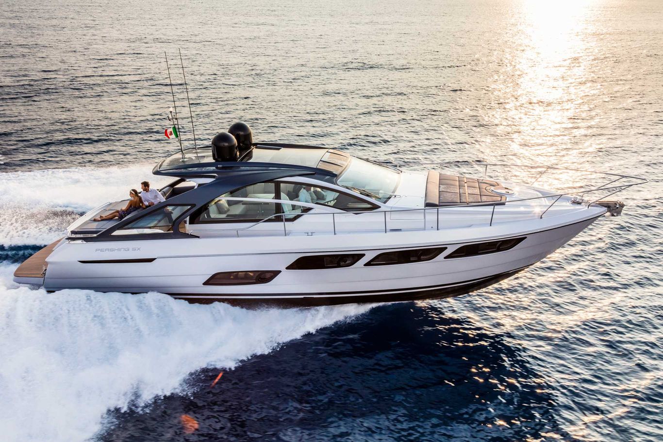 Pershing Yacht for sale: A chic, white Pershing 5X cruising proudly on a the open ocean.