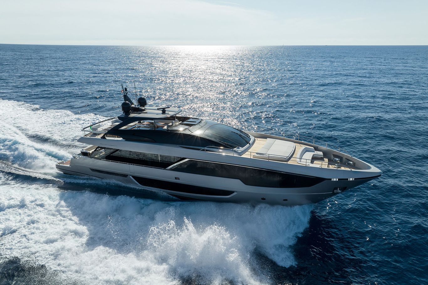Luxury Riva 102 Corsaro Super cruising through open waters at high speed with elegant profile