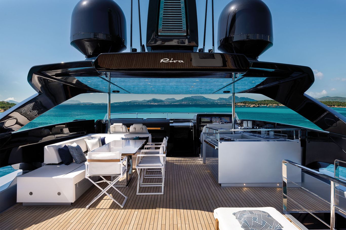 Upper deck of the Riva 102 Corsaro Super with stunning views of turquoise waters