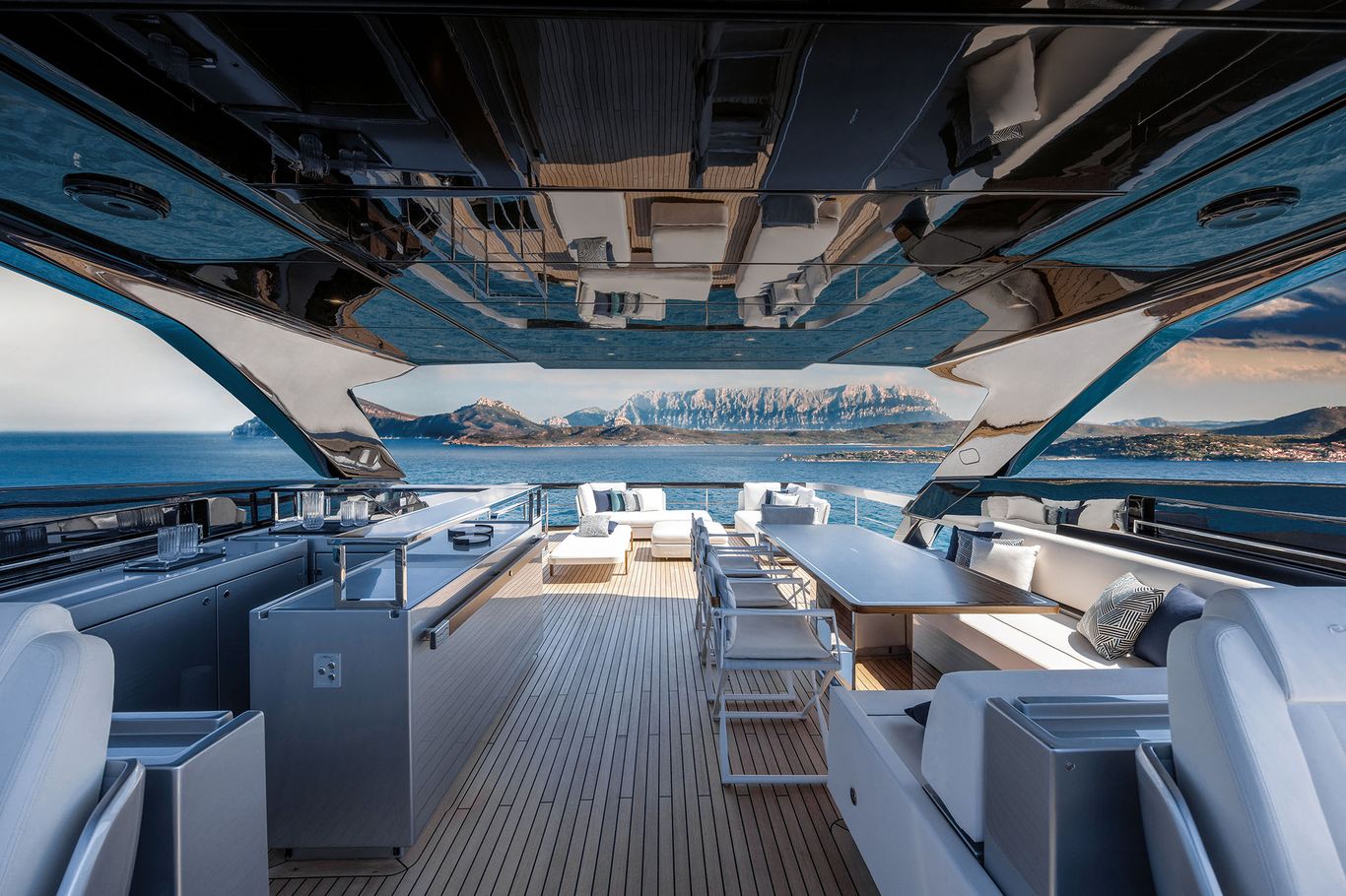 Spacious aft deck of Riva 102 Corsaro Super featuring al fresco seating area with panoramic ocean views