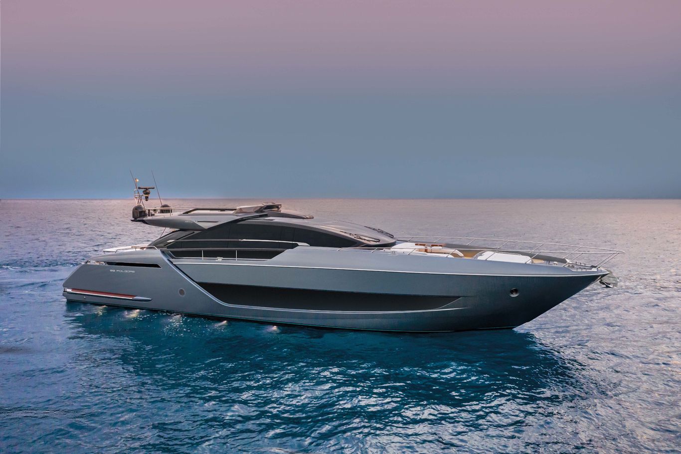 A white and black 88'Folgore by Riva sailing through the ocean under a beautiful sky.