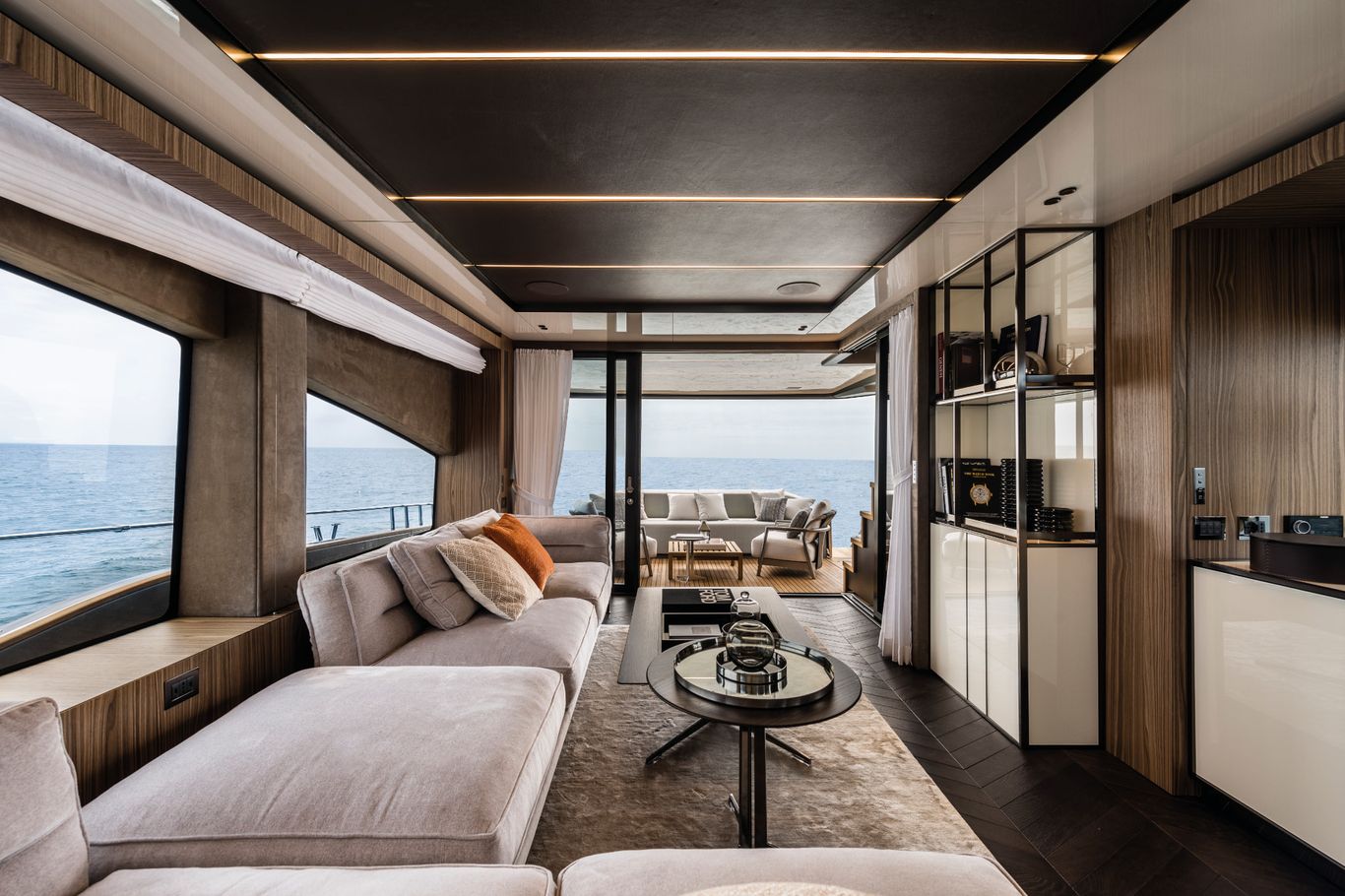 Cranchi Settantotto yacht interior with plush seating, spacious lounge, and ocean views.