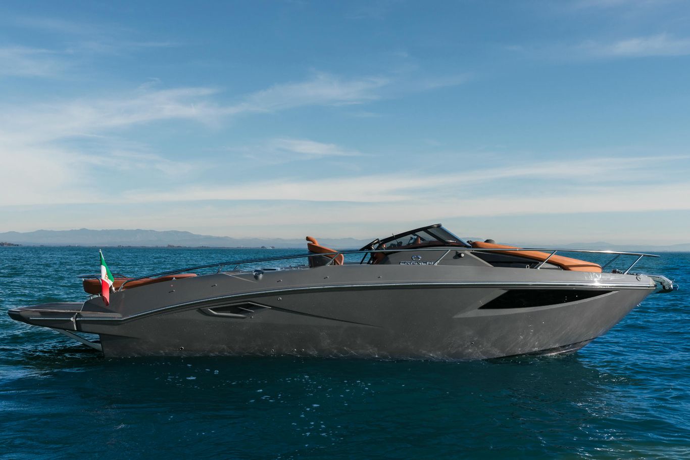 Cranchi Yacht: A grey and red Endurance 30 showing off its distinctive design, floating calmly on the sea.