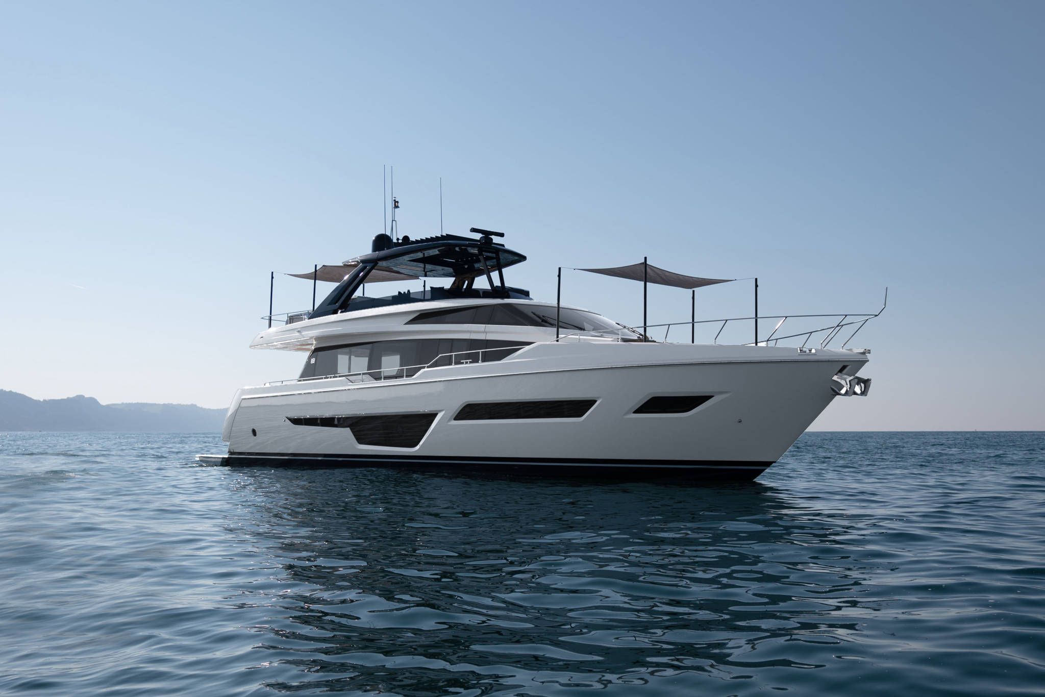 Ferretti Yachts Hong Kong: A magnificent white Ferretti Yachts 780 showcased on the open sea for sale.