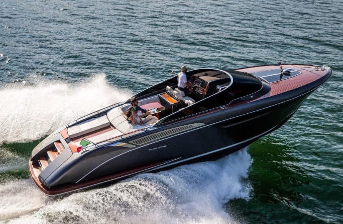 Yacht brokerage: Riva Rivamare 38 in black, speeding through the water.