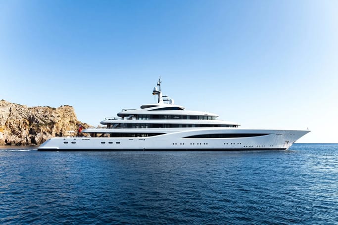 Faith by Feadship, built massively, is in white and has a classy exterior, floating on calm waters on a bright day.